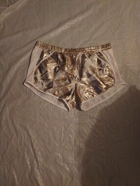 Under Armour Women's Gold Metallic and White Athletic Shorts